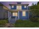Charming two-story home with a blue exterior, inviting front porch, and well-maintained lawn at 4689 Tanner Peak Trl, Brighton, CO 80601