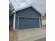 Detached two-car garage with matching siding at 4689 Tanner Peak Trl, Brighton, CO 80601