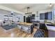 Open floor plan featuring a modern kitchen with stainless steel appliances and a decorative center island at 4689 Tanner Peak Trl, Brighton, CO 80601