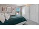 Bright bedroom with a queen bed, large closet, and city views at 2 Adams St # 1401, Denver, CO 80206