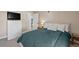 Guest bedroom with a double bed and a dresser next to a TV at 2 Adams St # 1401, Denver, CO 80206