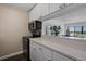 Modern kitchen with white cabinets and stainless steel appliances at 2 Adams St # 1401, Denver, CO 80206