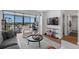 Modern living room with city views and comfortable seating at 2 Adams St # 1401, Denver, CO 80206