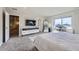 Bright bedroom with large windows, neutral tones, and plush carpet at 9099 Sedalia St, Commerce City, CO 80022