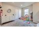 Neutral bedroom with playroom, closet, and carpeted floor at 9099 Sedalia St, Commerce City, CO 80022