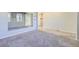 Bright, open living space with plush carpeting, modern mirrors and abundant natural light at 9099 Sedalia St, Commerce City, CO 80022