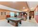 Finished basement with a pool table and plenty of room for entertaining at 7132 S Irvington Ct, Aurora, CO 80016