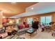 Finished basement with a cozy seating area, pool table, and plenty of room for entertaining at 7132 S Irvington Ct, Aurora, CO 80016