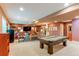 Finished basement with a pool table and cozy seating area at 7132 S Irvington Ct, Aurora, CO 80016