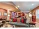 Finished basement with a cozy seating area, pool table, and bar area at 7132 S Irvington Ct, Aurora, CO 80016