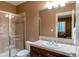 Bathroom with a shower, vanity, and modern fixtures at 7132 S Irvington Ct, Aurora, CO 80016