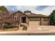 Charming two-story home features a two-car garage, stone accents, and well-maintained landscaping at 7132 S Irvington Ct, Aurora, CO 80016