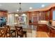 Gourmet kitchen features a center island with a cooktop and stainless steel appliances at 7132 S Irvington Ct, Aurora, CO 80016