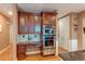 Well-equipped kitchen features stainless steel double ovens and custom cabinetry at 7132 S Irvington Ct, Aurora, CO 80016
