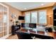 Home office featuring natural light, a large desk, and comfortable seating at 7132 S Irvington Ct, Aurora, CO 80016