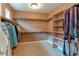 Spacious walk-in closet with built-in shelving and ample storage space at 7132 S Irvington Ct, Aurora, CO 80016