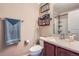 Cozy bathroom with granite counters, a wood vanity, and a shower and tub combination at 24748 E Layton Pl, Aurora, CO 80016