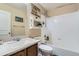 Bathroom with a sink, vanity, and a combined tub and shower at 24748 E Layton Pl, Aurora, CO 80016