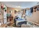 A cozy bedroom features a comfortable bed, natural light, and stylish decor at 24748 E Layton Pl, Aurora, CO 80016