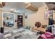 This is a cozy bedroom with tan walls, carpet, and a desk with various items on it at 24748 E Layton Pl, Aurora, CO 80016