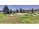 A common green area and circular seating in the Tollgate Crossing community at 24748 E Layton Pl, Aurora, CO 80016