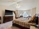 Bedroom with a TV, carpeted floor and seating area at 6293 Braun Cir, Arvada, CO 80004