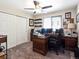 Bedroom or office with a ceiling fan, double closet, and a window with shades at 6293 Braun Cir, Arvada, CO 80004