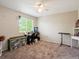 Bedroom featuring a window, ceiling fan, and a desk for working or studying at 6293 Braun Cir, Arvada, CO 80004