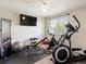 Exercise room featuring an elliptical, stationary bike, free weights and a large mirror at 6293 Braun Cir, Arvada, CO 80004