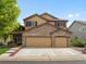 Charming two-story home boasts a brick facade and well-manicured lawn creating an inviting curb appeal at 6293 Braun Cir, Arvada, CO 80004