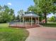 A charming gazebo with seating offers a shady spot to relax in the community at 6293 Braun Cir, Arvada, CO 80004