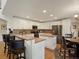 Well-equipped kitchen featuring white cabinetry, stainless steel appliances, and ample counter space at 6293 Braun Cir, Arvada, CO 80004