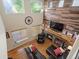 Open-concept living room with a fireplace and wood accent wall as seen from above at 6293 Braun Cir, Arvada, CO 80004