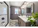 Stylish bathroom features a double vanity, modern fixtures, and a shower, for a spa-like experience at 721 Park Ln, Lakewood, CO 80214