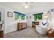 Bright bedroom with ample sunlight, modern furnishings, and peaceful decor at 721 Park Ln, Lakewood, CO 80214