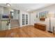 Bright entryway with wood floors, a staircase with decorative tiles, and natural light at 721 Park Ln, Lakewood, CO 80214