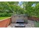 Private backyard hot tub surrounded by lush greenery, creating a serene and relaxing oasis at 721 Park Ln, Lakewood, CO 80214