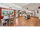 Open concept kitchen with stainless appliances, large island, and hardwood floors throughout at 721 Park Ln, Lakewood, CO 80214