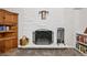 Living room featuring a stylish fireplace, display shelving, and decorative accents at 721 Park Ln, Lakewood, CO 80214