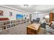Bright living room with built-in bookcases, neutral walls, carpeting, and an inviting atmosphere at 721 Park Ln, Lakewood, CO 80214
