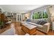 Spacious living room with hardwood floors, a comfortable sectional sofa, and natural light at 721 Park Ln, Lakewood, CO 80214