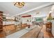 Bright and open living space with hardwood floors, kitchen, and dining area at 721 Park Ln, Lakewood, CO 80214