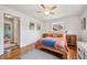 Cozy main bedroom with hardwood floors, natural light, and ample space for relaxation and rest at 721 Park Ln, Lakewood, CO 80214