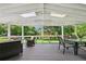 Spacious covered patio with skylights offers a comfortable and versatile outdoor living space with backyard views at 721 Park Ln, Lakewood, CO 80214