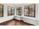 Bright room with hardwood floors, lots of natural light, and built-in bench seating at 980 S Dahlia St # A, Denver, CO 80246