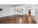 Spacious living room featuring hardwood floors and an open concept kitchen at 980 S Dahlia St # A, Denver, CO 80246