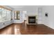 Inviting living room showcasing a cozy fireplace, hardwood floors, and natural light at 980 S Dahlia St # A, Denver, CO 80246