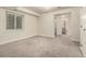 Large basement room with neutral carpet, bright window, and potential for flexible use as a living area at 10172 Woodrose Ln, Highlands Ranch, CO 80129