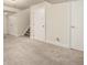 Spacious carpeted basement area with multiple doors, offering ample storage and potential living space at 10172 Woodrose Ln, Highlands Ranch, CO 80129