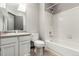 Well-lit bathroom with a shower and tub combination, vanity with sink, and neutral color scheme at 10172 Woodrose Ln, Highlands Ranch, CO 80129